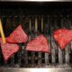 Grilling Matsusaka beef at Matsusakagyu Yakiniku M in Osaka